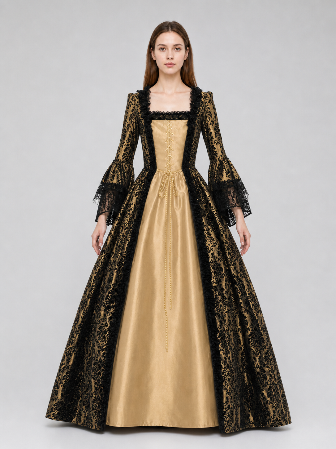 The dress is designed in a historical style with theatrical and decorative details. A golden-beige center is paired with black outer panels and damask-patterned trim, creating a striking contrast. The fitted bodice is decorated with visible