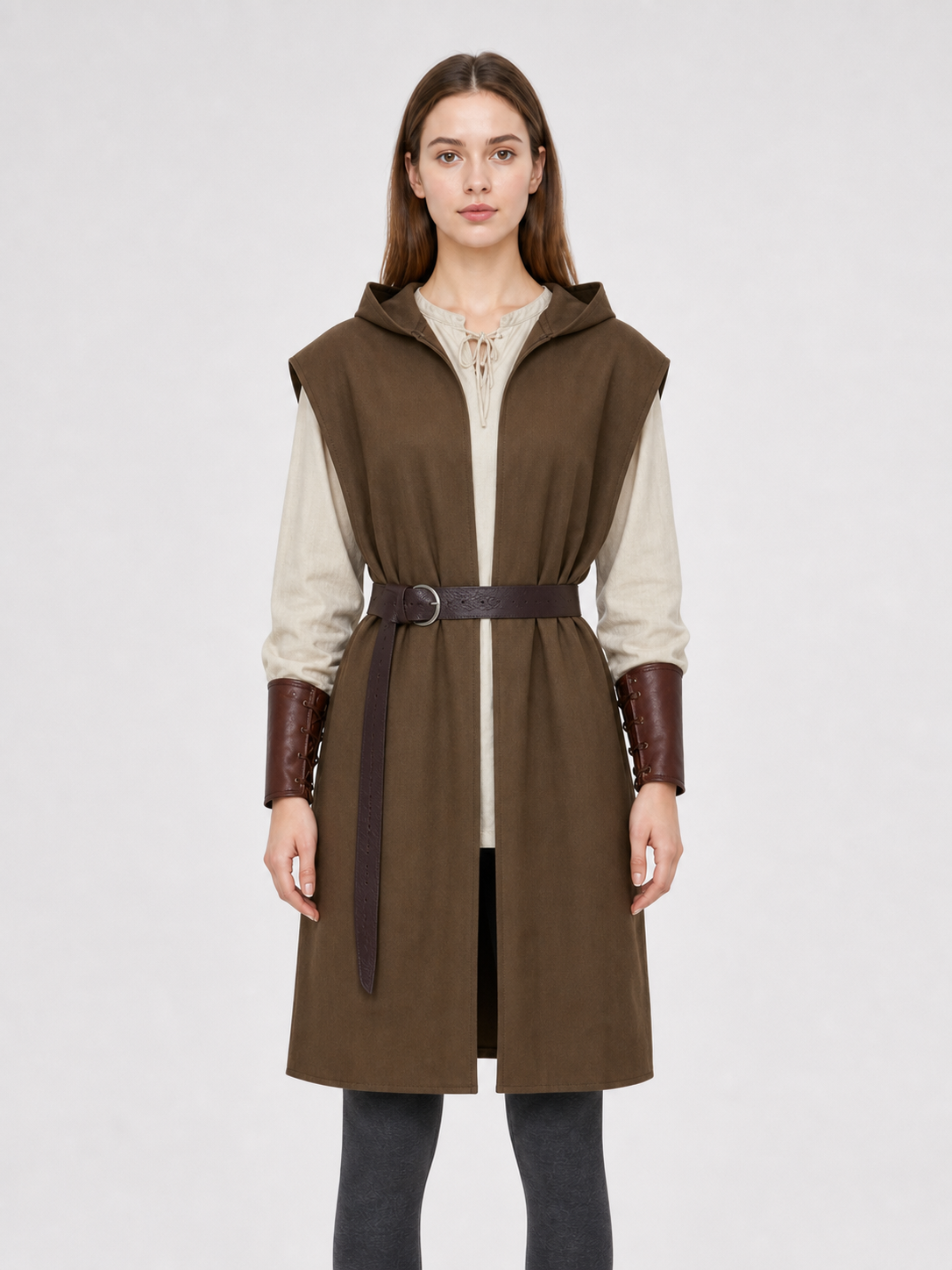 Front upper-body view of a brown hooded vest with an open front, dark belt, and cream long-sleeve shirt