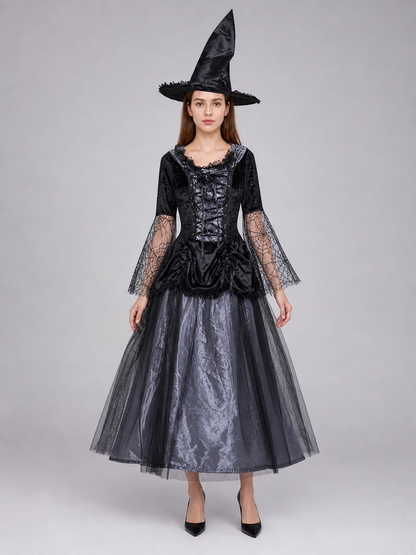 Gothic-style witch costume dress with hat for themed events. The design is mainly black and dark gray, with patterned textured fabric and sheer black accents. The look is centered on a long dress with a fitted lace-up corset, a ruffled neck