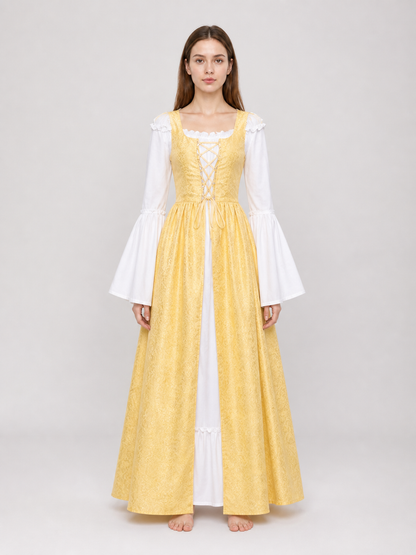The yellow dress is designed in a fairytale costume style with expressive details inspired by medieval and Renaissance looks. It features a long, floor-length silhouette and a flared skirt paired with a fitted waistline. The front of the bo