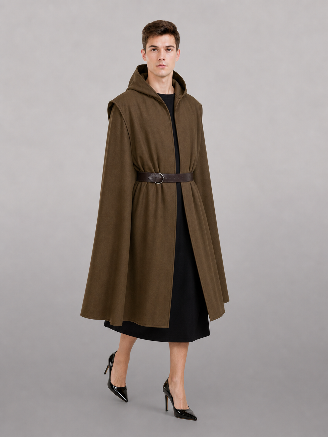 Brown hooded vest with a dark belt on a female model over a black dress, shown full-body with black high heels