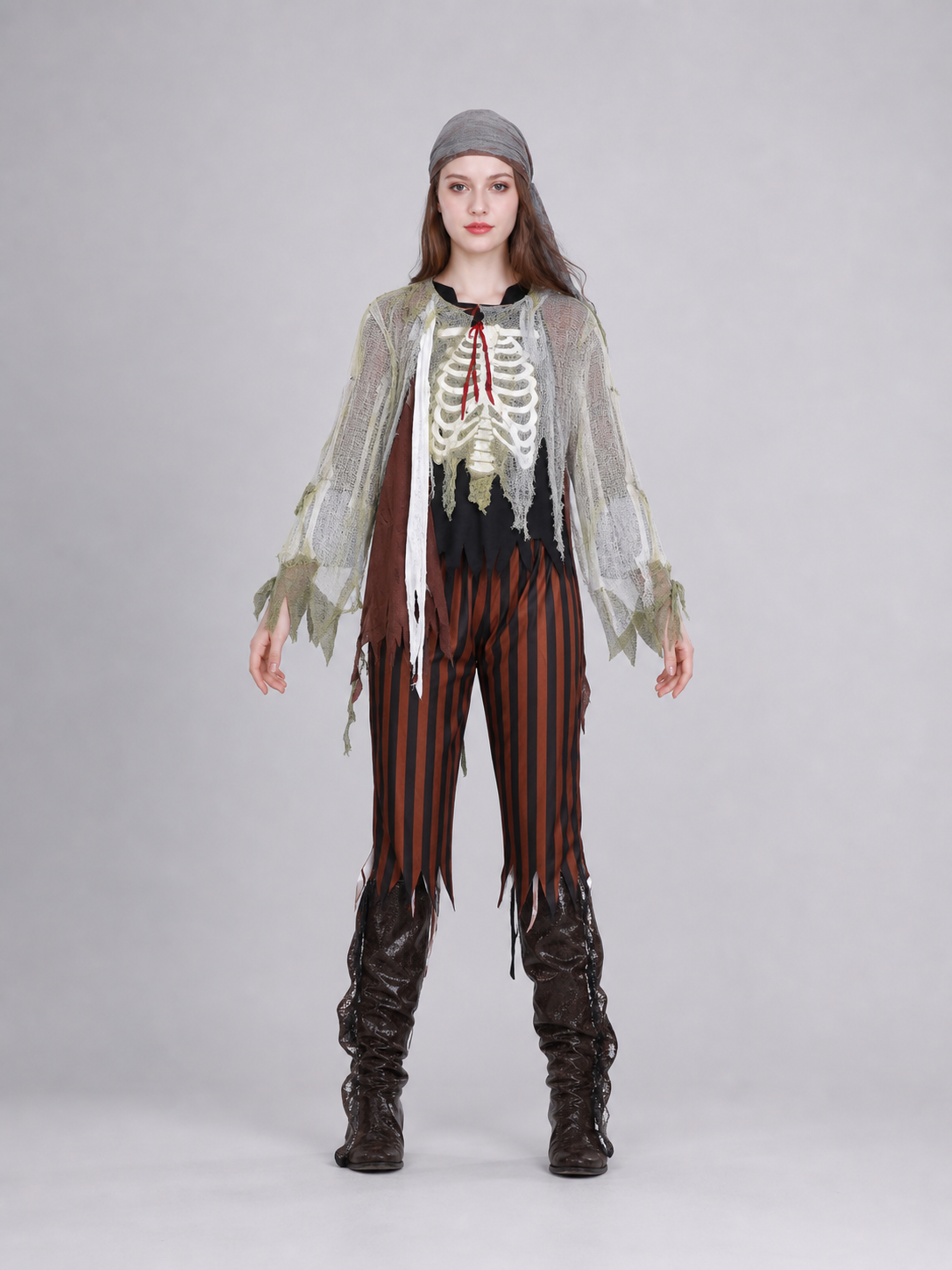Pirate costume for masquerade and cosplay in a distressed pirate style. The set includes a long-sleeve top with a skeleton print, black-and-brown vertical striped pants, a black eye patch, and dark brown shoe covers. The top and the edges o