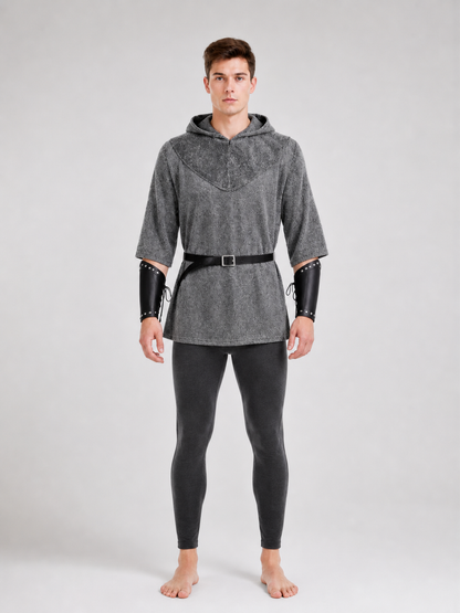 The costume is designed in the style of a medieval knight and is suitable for cosplay and stage performances. The set includes a gray hooded top with a layered front design, black pants, a belt, bracers, and greaves. The gray-and-black colo