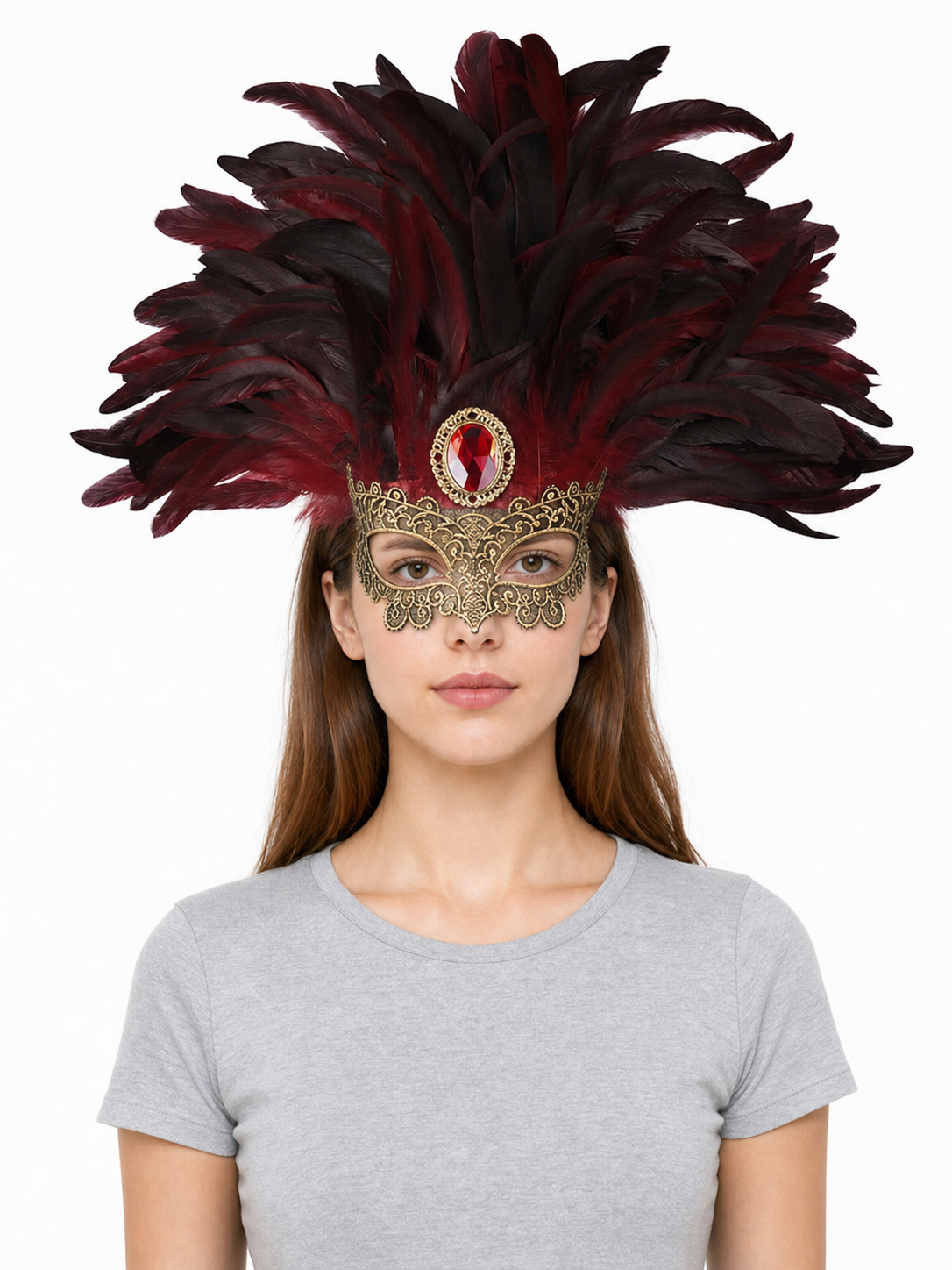 Burgundy and black feathered mask headpiece with ornate gold filigree and red jewel, shown on a front-facing model against white