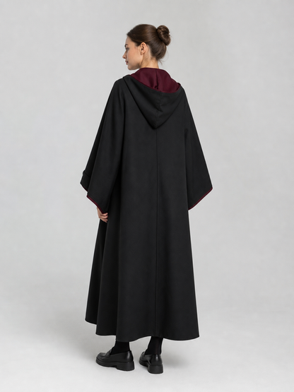 Black wizard cloak with emblem and wand