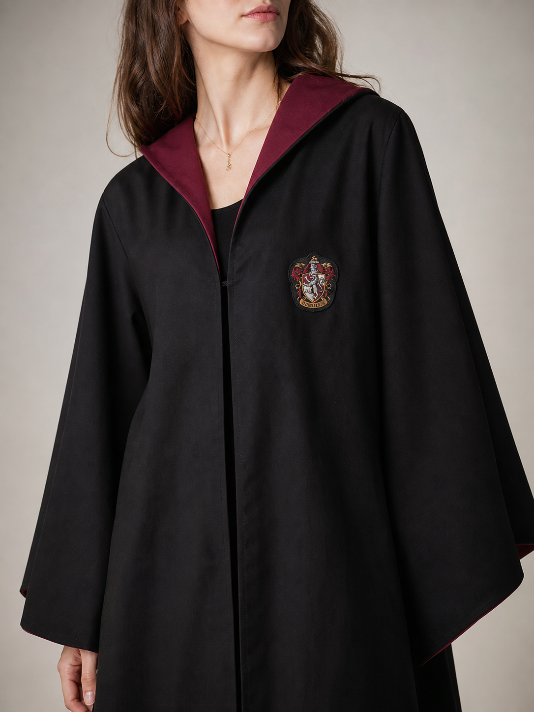 Black wizard cloak with emblem and wand
