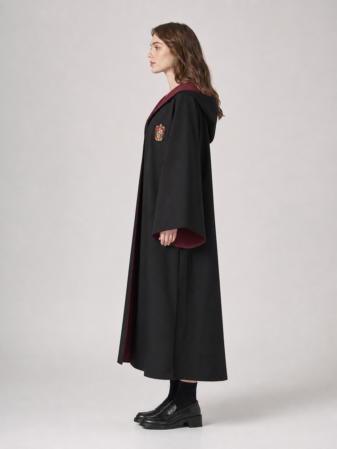 Black wizard cloak with emblem and wand