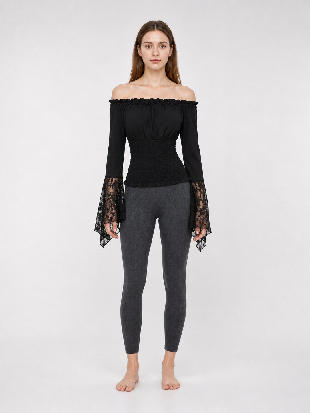 Black off-the-shoulder blouse with ruffles and long sleeves
