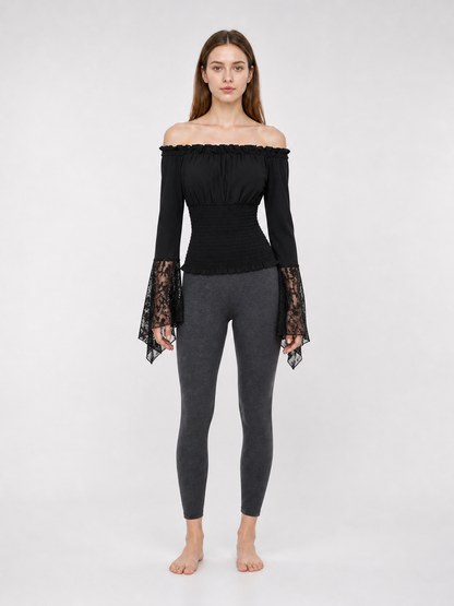 Black off-the-shoulder blouse with ruffles and long sleeves