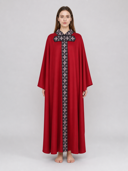 The cape is red with black decorative elements. It has a loose cloak-style silhouette, wide sleeves, and a collar with black patterned detailing. The front features a vertical decorative stripe down the center and a horizontal stripe across