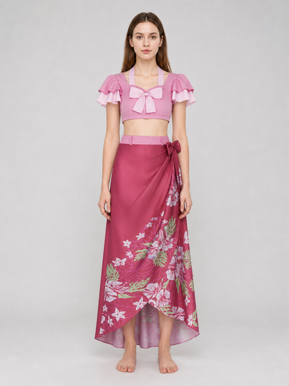 This cosplay set is designed as a short-sleeve crop top and a long skirt. It includes a top, a half-skirt, and decorative bows. There is a bow on the chest of the top, and another bow is placed on the side of the skirt waist. The top has an