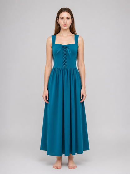 Teal sleeveless dress with square neckline, front lace-up detail, gathered waist, and long flowing skirt shown from the front