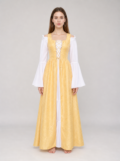 The yellow dress is designed in a fairytale costume style with expressive details inspired by medieval and Renaissance looks. It features a long, floor-length silhouette and a flared skirt paired with a fitted waistline. The front of the bo