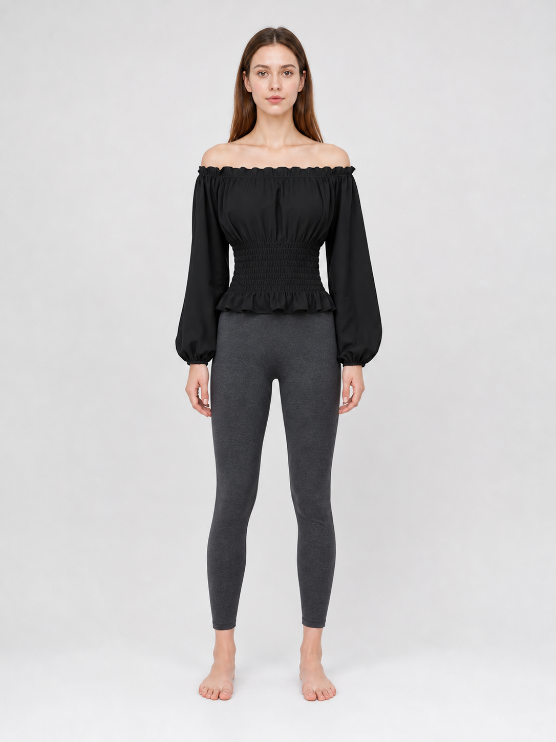 Black off-the-shoulder blouse with ruffles