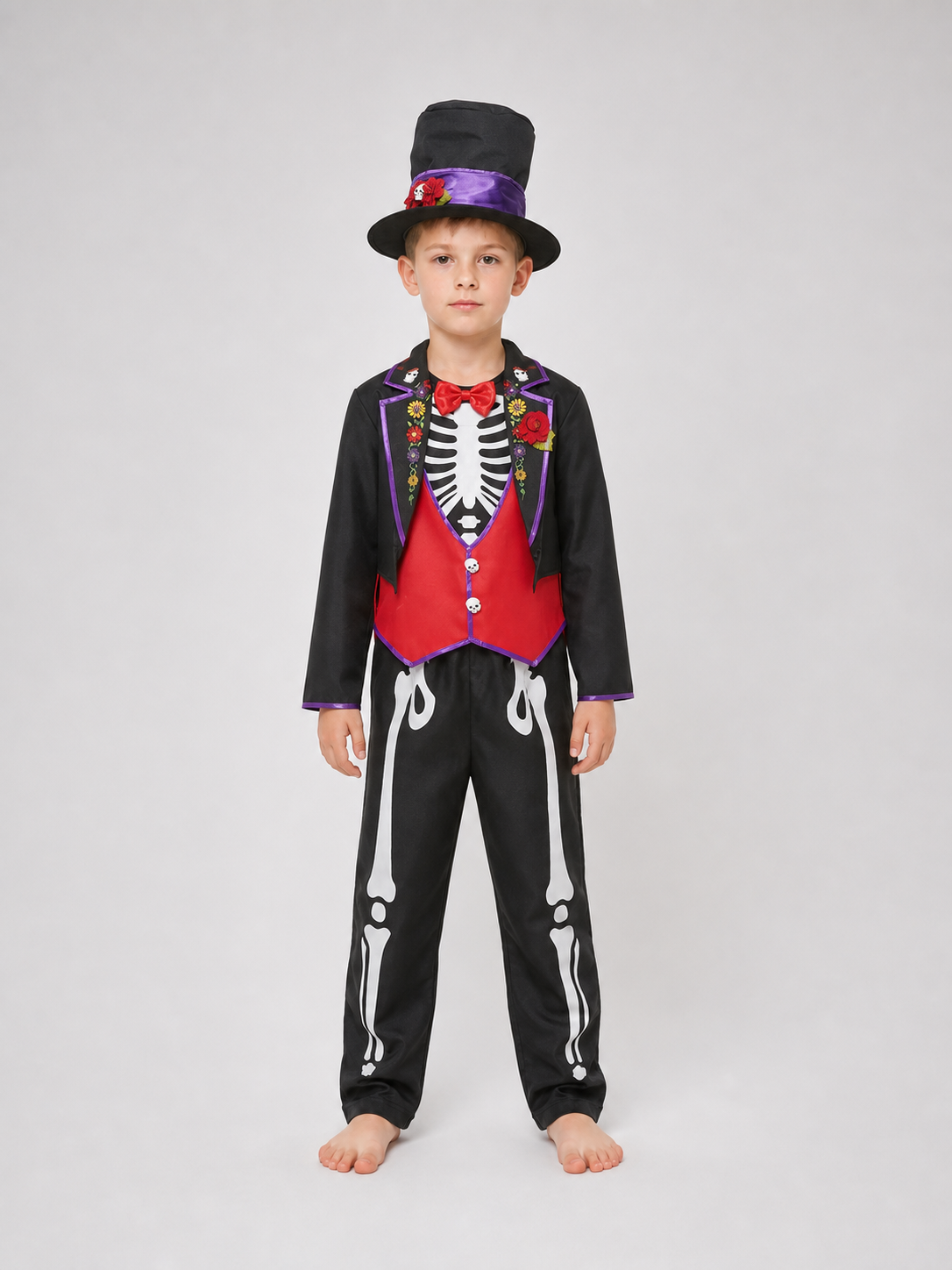 This skeleton costume is designed in the Mexican style of the Day of the Dead celebration. The outfit includes a black jacket with purple trim and floral decorations, a red vest-style front panel with decorative buttons, a red bow tie, blac