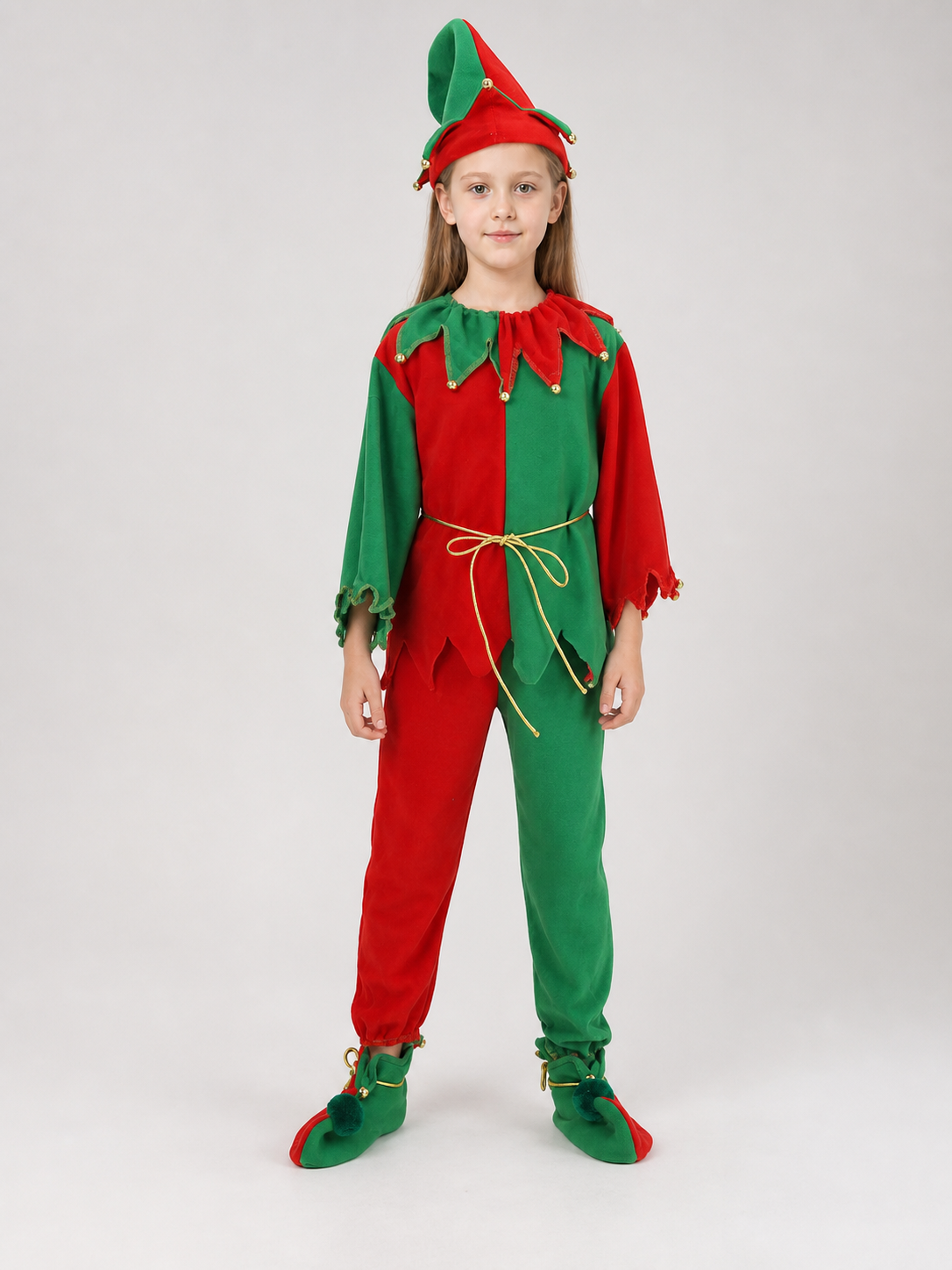 Children's Christmas elf costume in a festive red-and-green design with gold and yellow trim. The set includes a pointed hat with a curled tip and small dangling decorative elements, a long-sleeve top, pants, a gold tie belt for the waist, 