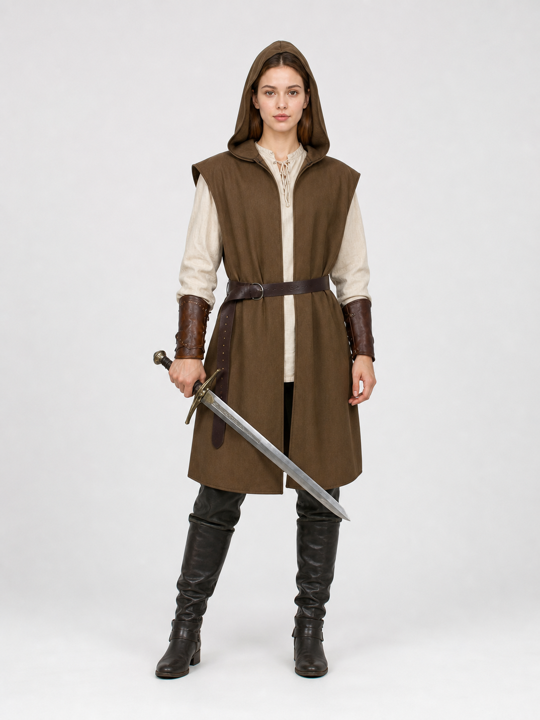 Brown hooded vest with a dark belt on a full-body female model wearing a cream shirt and tall dark boots