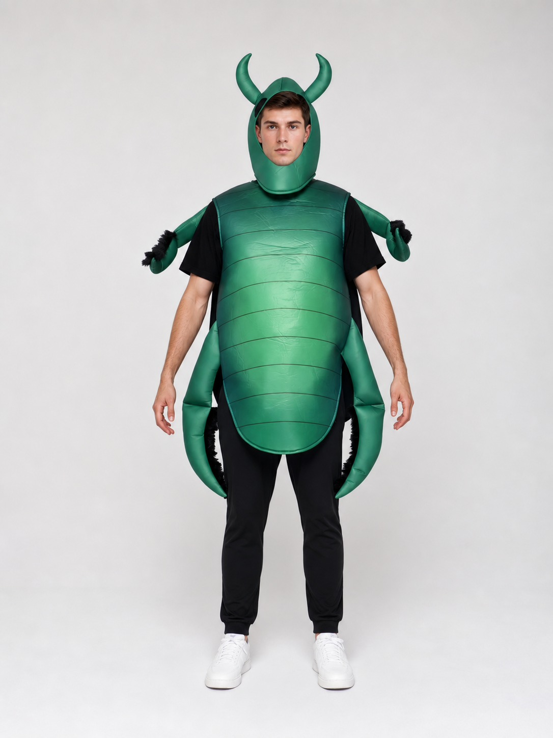 The beetle costume features a full-body insect silhouette with a large segmented green panel on the abdomen. The look is completed by a curved headpiece resembling horns, along with green side and hand elements that imitate insect limbs. Th