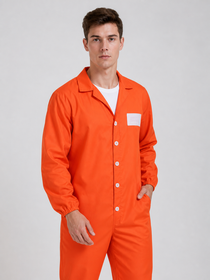 Orange coverall with a smooth fabric look, open collar, white buttons, chest patch, and elastic cuffs, shown in a close upper-body view