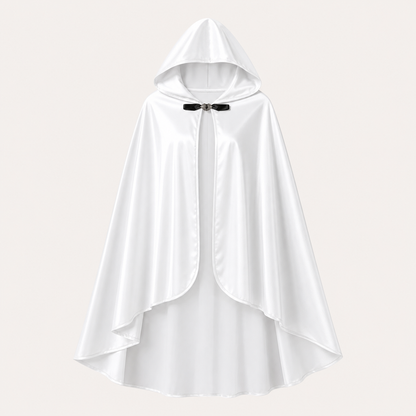 White hooded cape displayed alone against a light background, showing the satin-look fabric, rounded front edges, layered hem, and black toggle