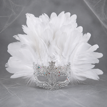 White feather masquerade mask displayed upright against a gray background, showing the ornate silver-tone eye frame