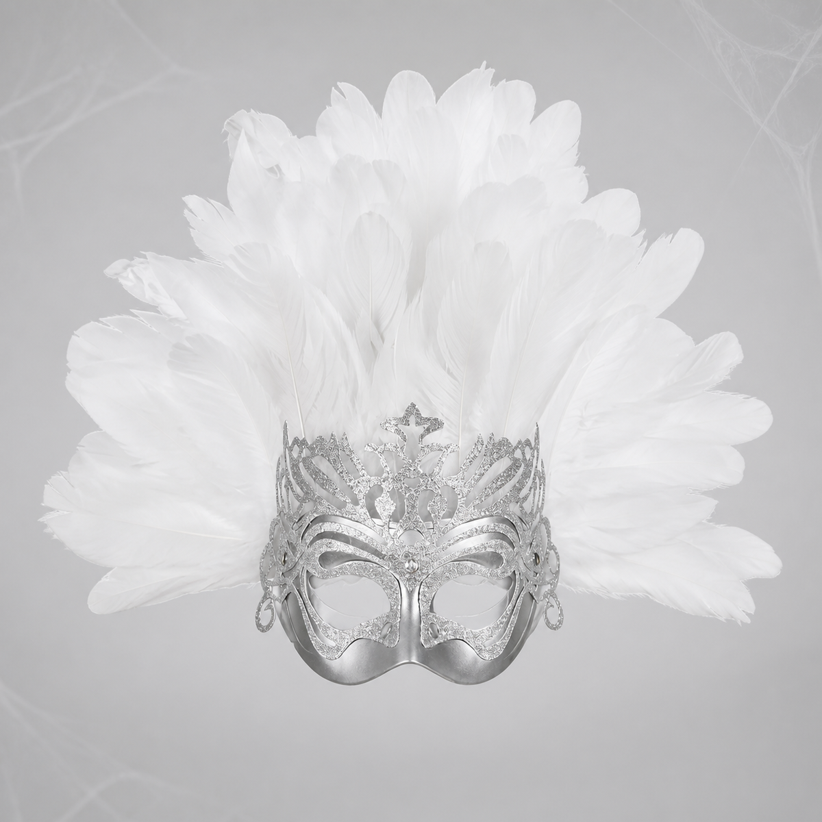 Silver decorative eye mask with a broad fan of white feathers shown against a gray background