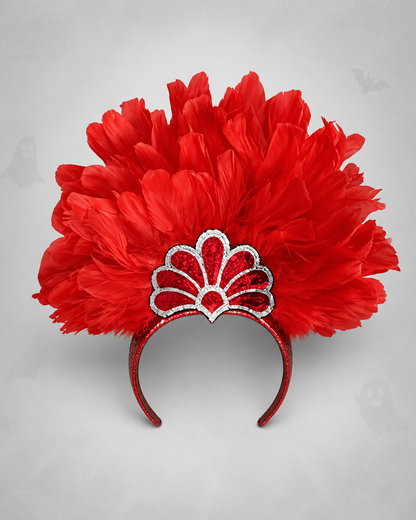 Red feather headband with a silver-trimmed fan decoration, shown from the front against a gray background