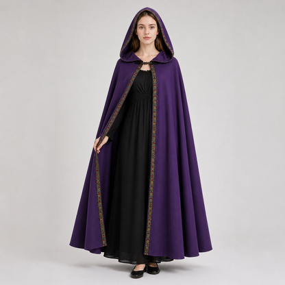 Information card about the purple hooded cape, showing velvet fabric, a neckline clasp, and decorative edge trim