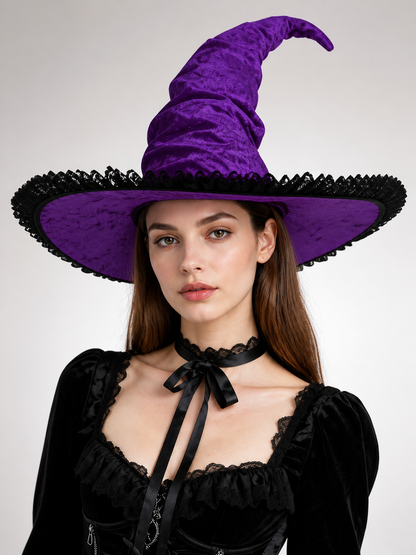 Purple velvet-look pointed witch hat with a wide brim and black trim, worn by a model against a plain background