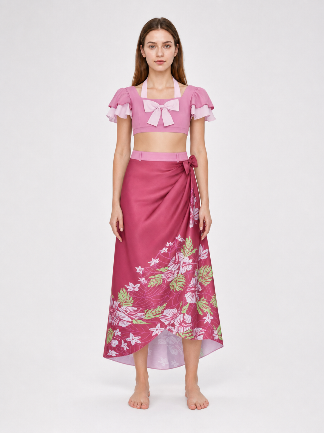This cosplay set is designed as a short-sleeve crop top and a long skirt. It includes a top, a half-skirt, and decorative bows. There is a bow on the chest of the top, and another bow is placed on the side of the skirt waist. The top has an