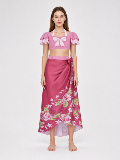 This cosplay set is designed as a short-sleeve crop top and a long skirt. It includes a top, a half-skirt, and decorative bows. There is a bow on the chest of the top, and another bow is placed on the side of the skirt waist. The top has an