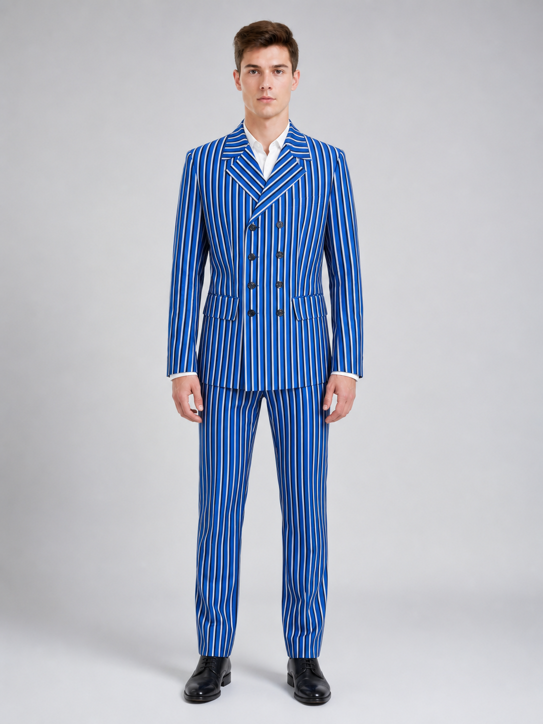 The Doctor Who cosplay double-breasted suit is designed in a white-and-blue color scheme with vertical stripes. The set includes a jacket and pants made in the same design. The jacket features a double-breasted closure, peaked lapels, and f