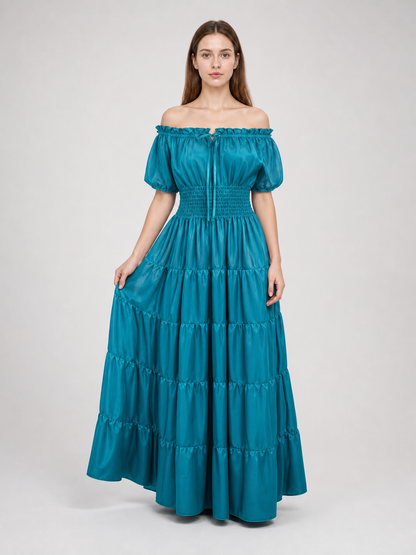 Romantic medieval-style maxi dress. This style features an off-the-shoulder neckline with a gathered elastic edge, short puff sleeves, and a fitted waist with gathering. The long floor-length skirt is made up of several tiers with soft gath