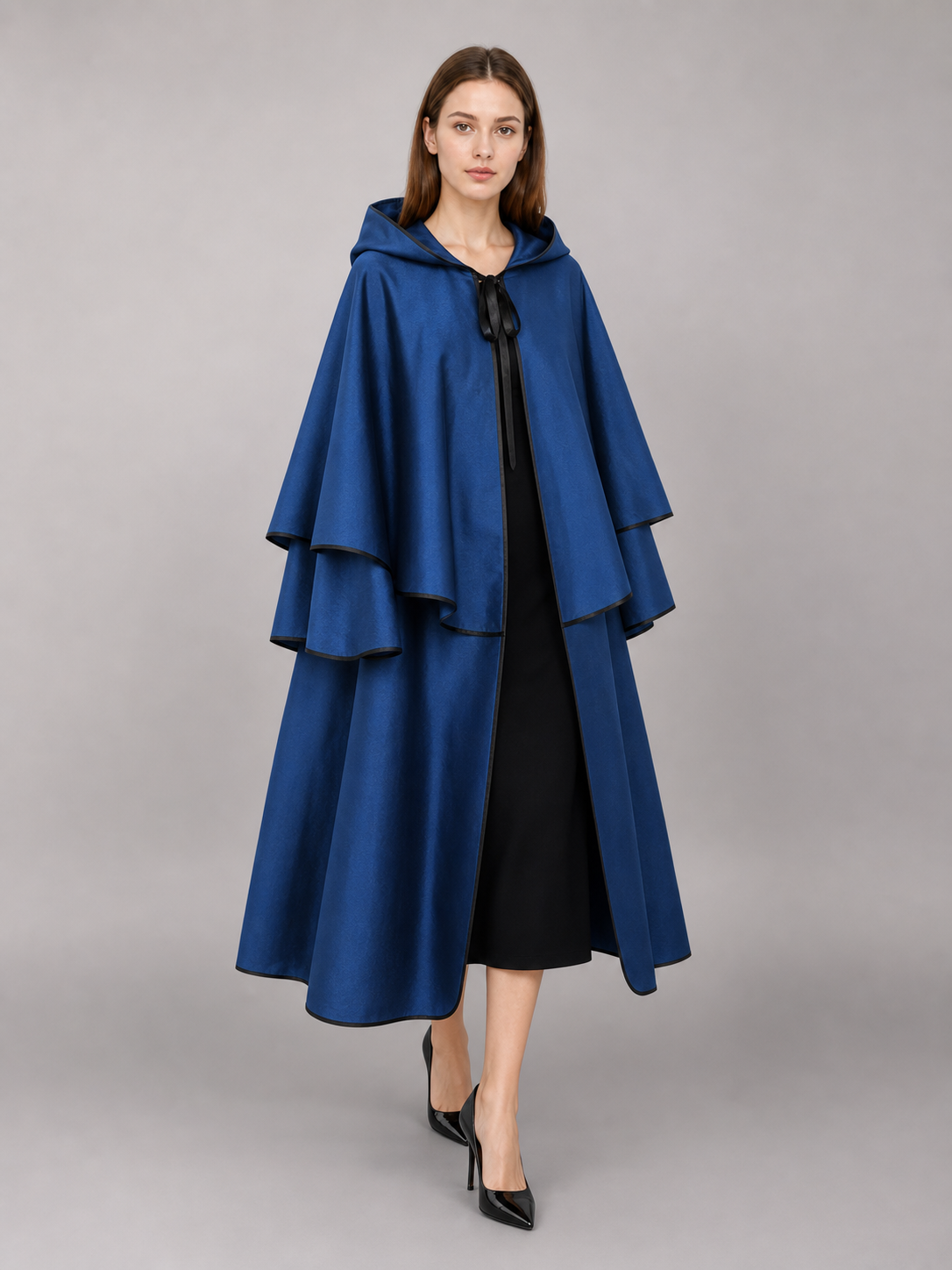 Blue hooded carnival cloak with black trim