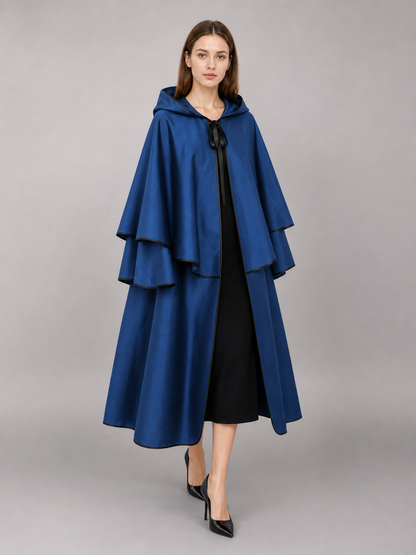 Blue hooded carnival cloak with black trim
