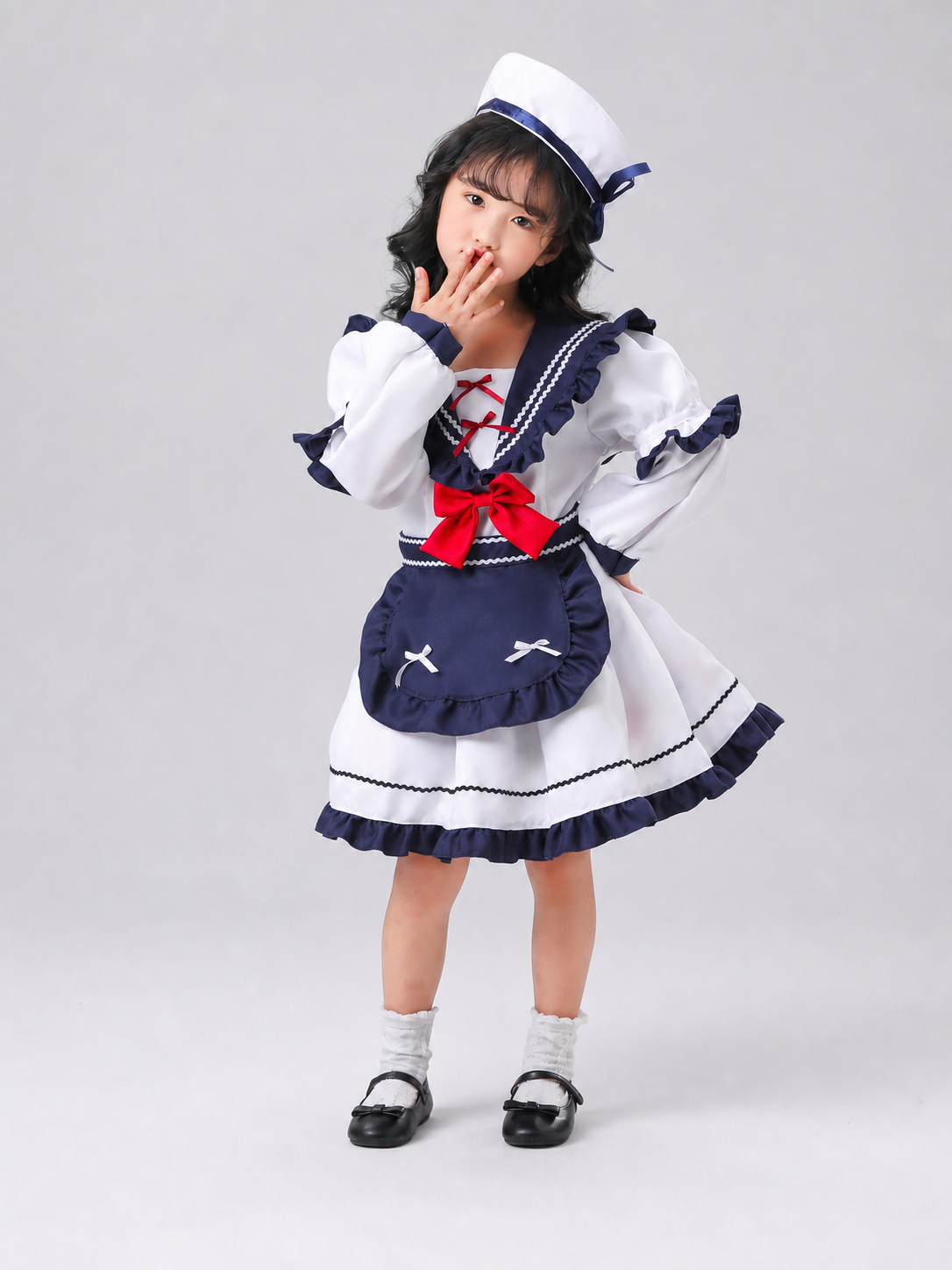 Nautical-style stage costume with bows