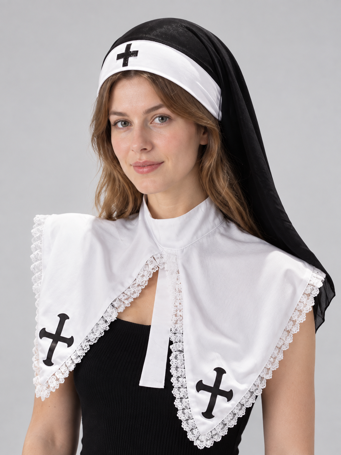 Black and white nun's headpiece with cross and veil
