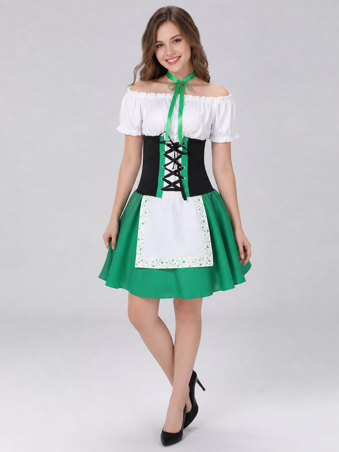 The dress is designed in a combination of white, green, and black. The silhouette emphasizes the waist and features a flared skirt. The design is finished with voluminous white short sleeves, a green tie collar, and green polka-dot trim. Th