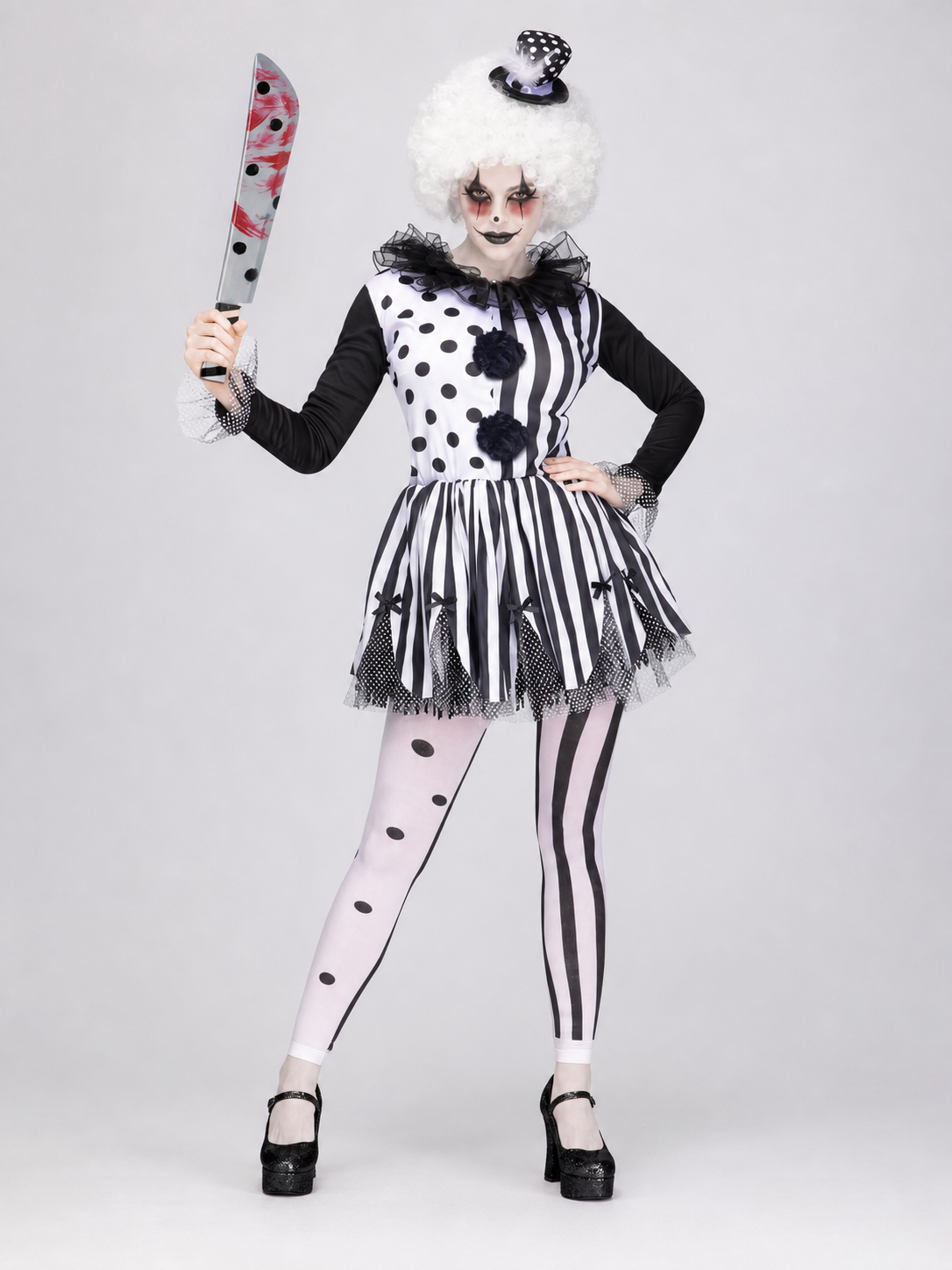 Black-and-white clown costume with a full skirt and decorative details for a Halloween look, themed party, or cosplay. The design is inspired by a circus clown: the top combines contrasting areas with black dots and vertical stripes, while 