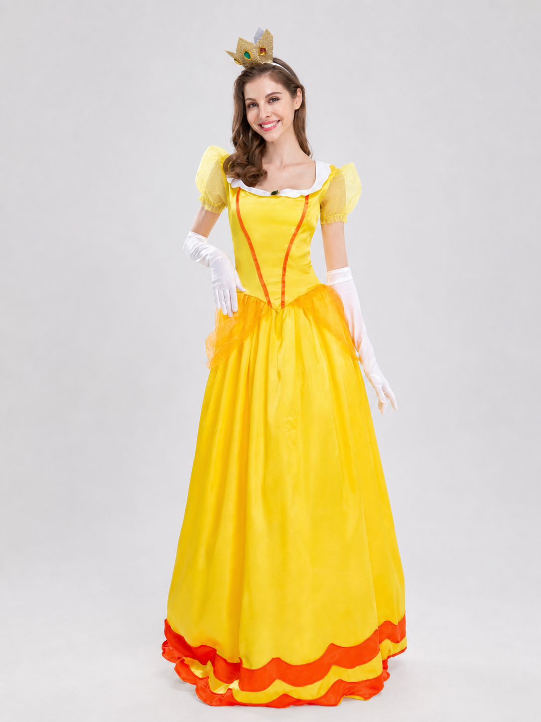 The princess costume features a festive style with distinctive details. The look is centered around a yellow dress with a fitted bodice and full skirt. Symmetrical orange decorative lines on the chest accent the bodice design. A white colla