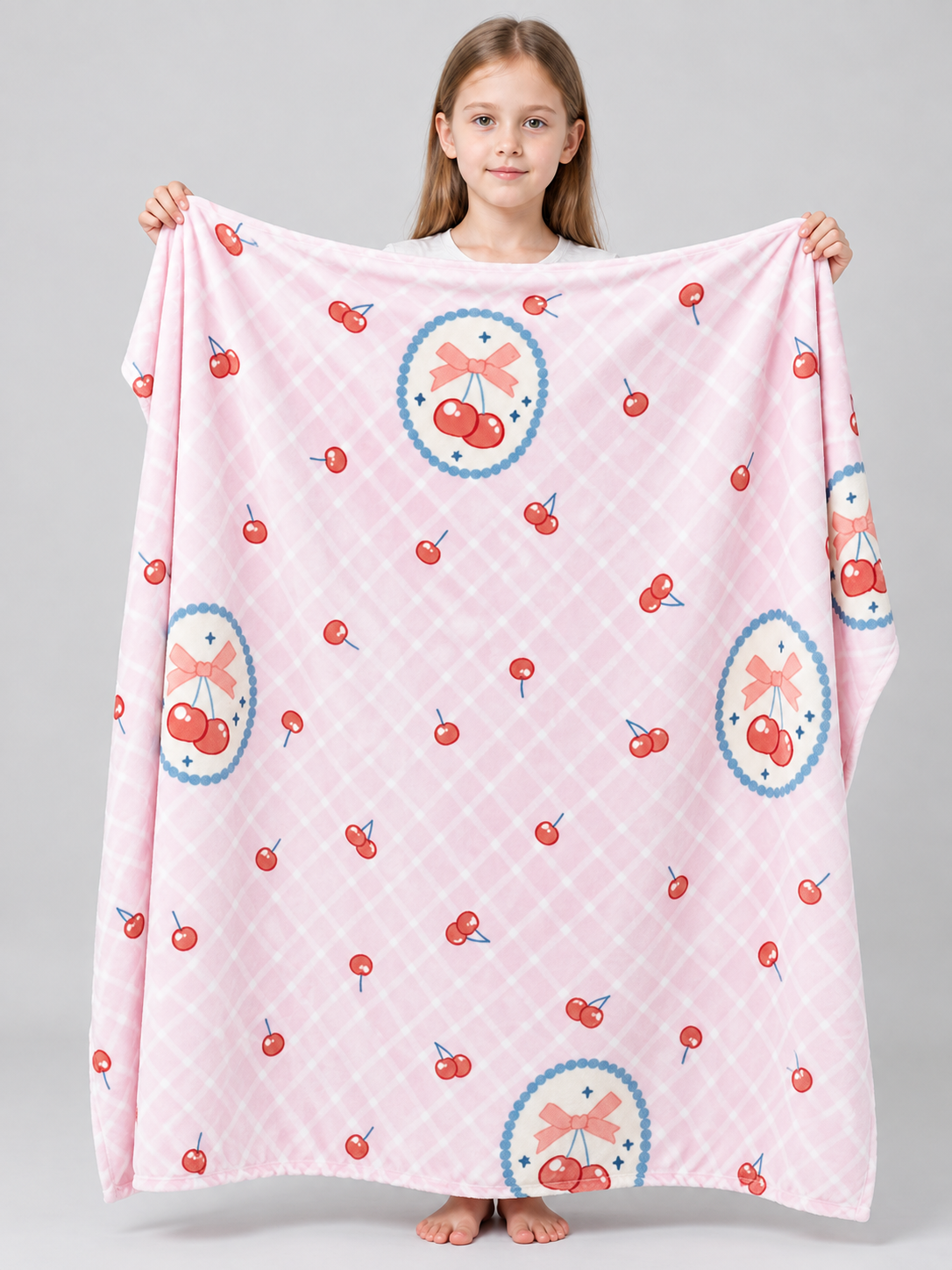 Pink reversible blanket with cherry and bow print, polyester