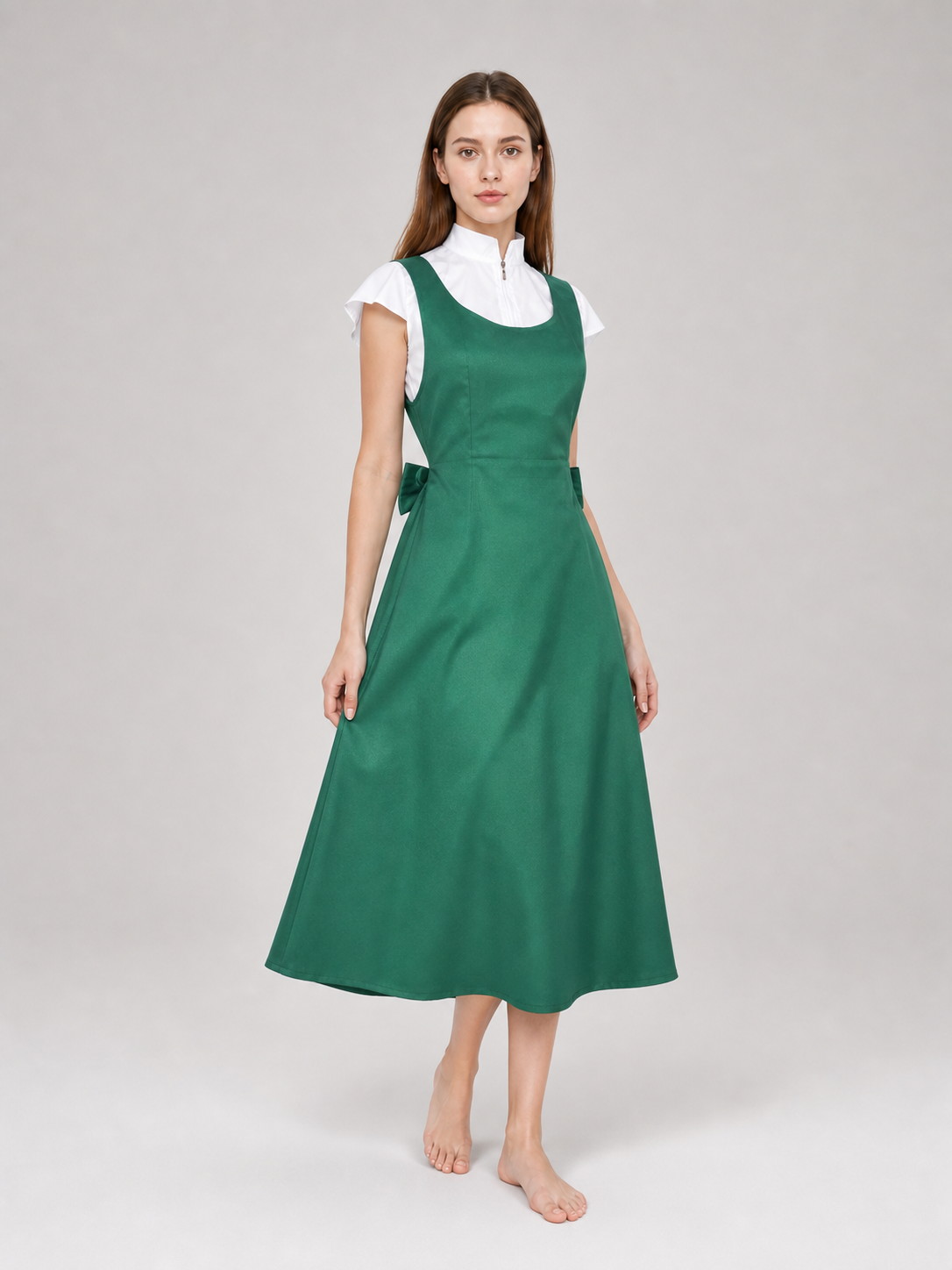 The green Kushina Uzumaki cosplay pinafore dress is designed in the recognizable style of the character from the anime Naruto: Shippuden. The design is a green pinafore dress with a square neckline, wide straps, and open pockets on the side