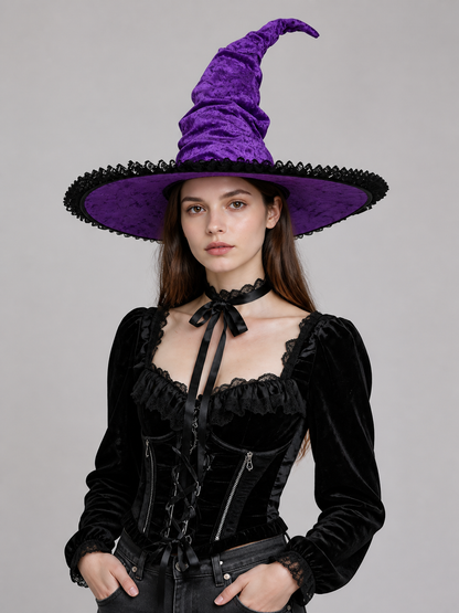 Purple and black pointed witch hat with a wide brim, shown on a model wearing a black costume against a plain gray background