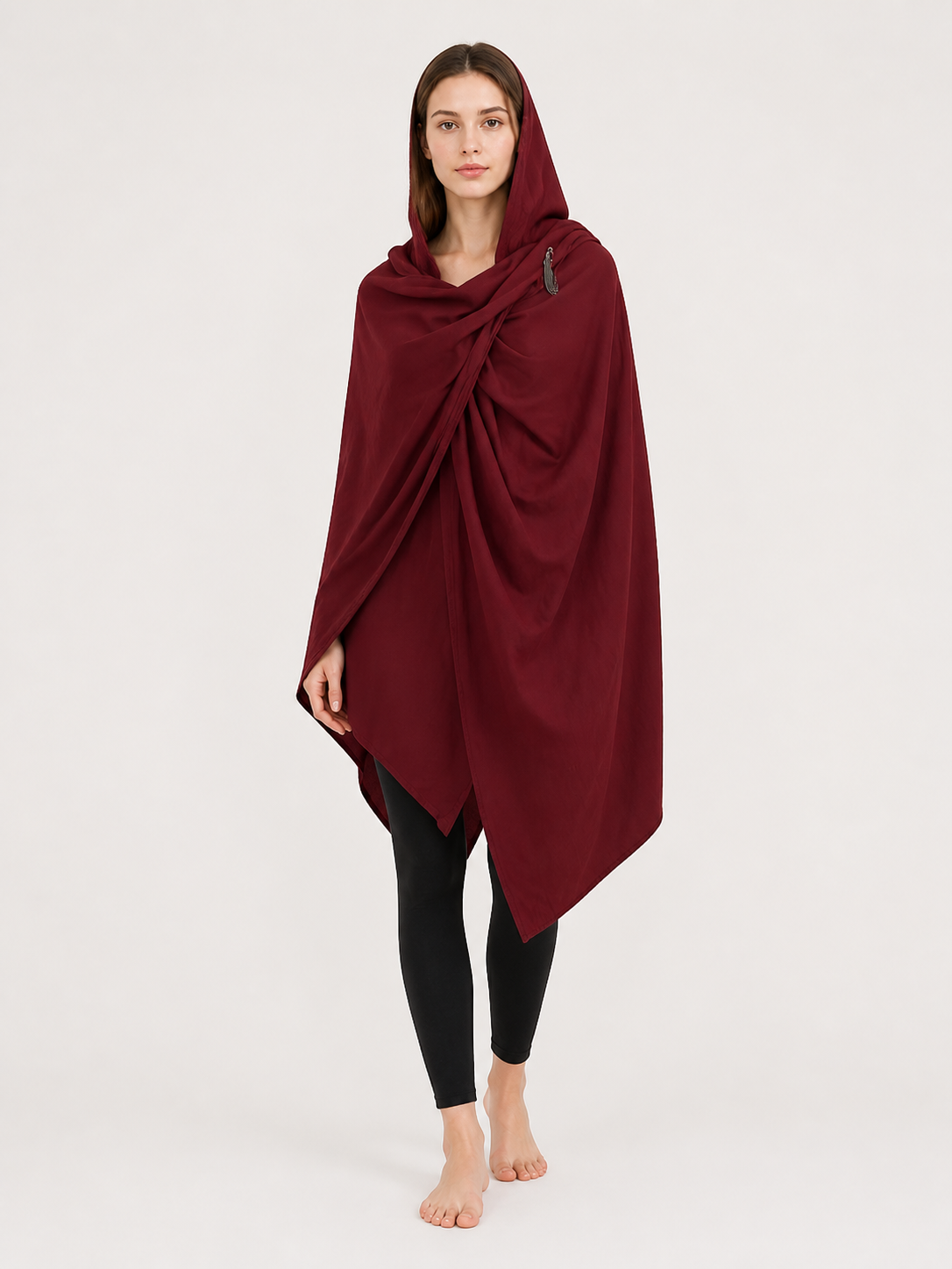 Burgundy hooded cloak with asymmetrical pointed hem and gathered front, shown full length on a woman in a studio