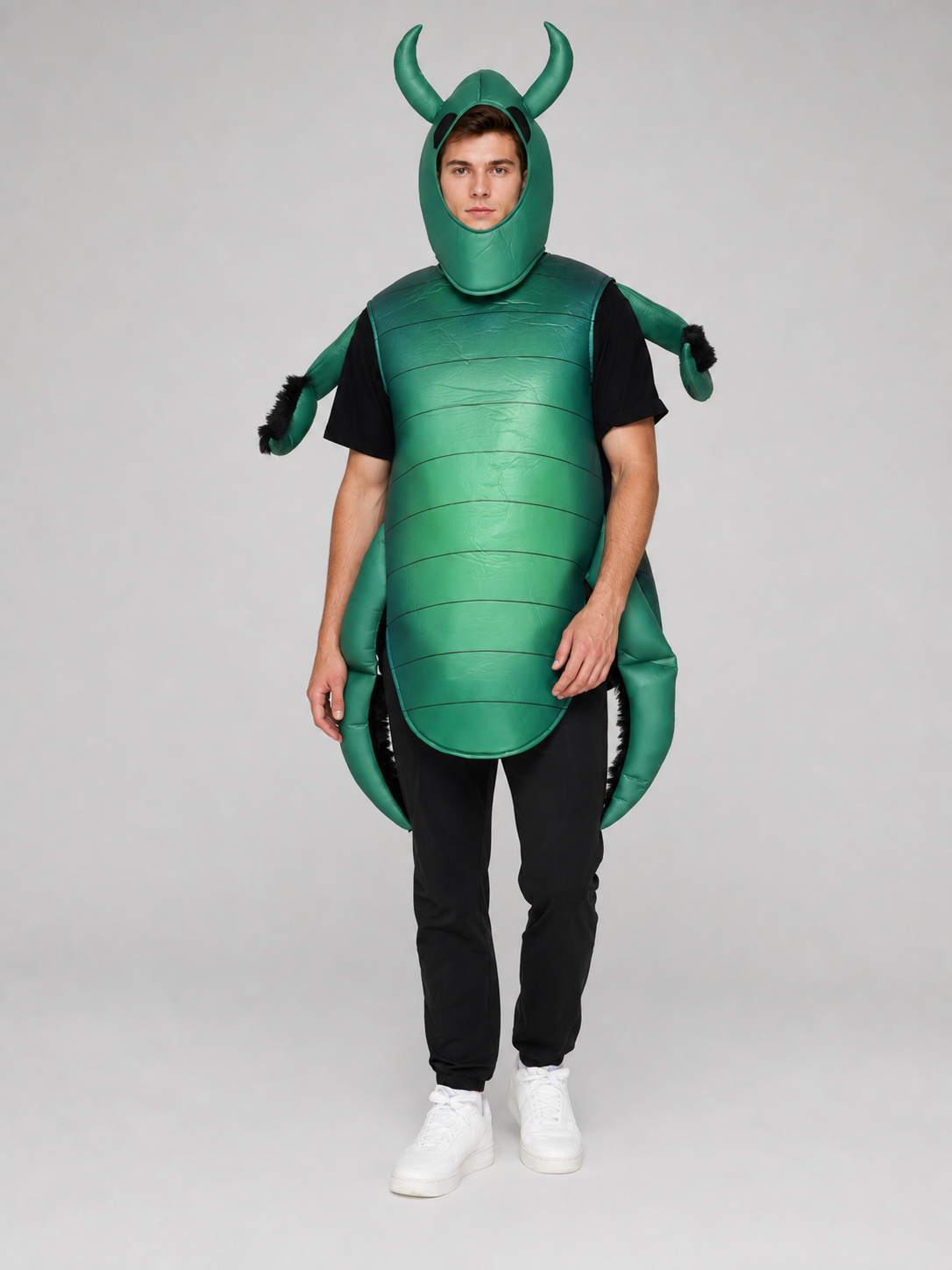 The beetle costume features a full-body insect silhouette with a large segmented green panel on the abdomen. The look is completed by a curved headpiece resembling horns, along with green side and hand elements that imitate insect limbs. Th