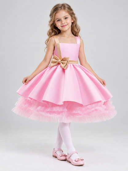 Pink girls' party dress with bow and puffy skirt