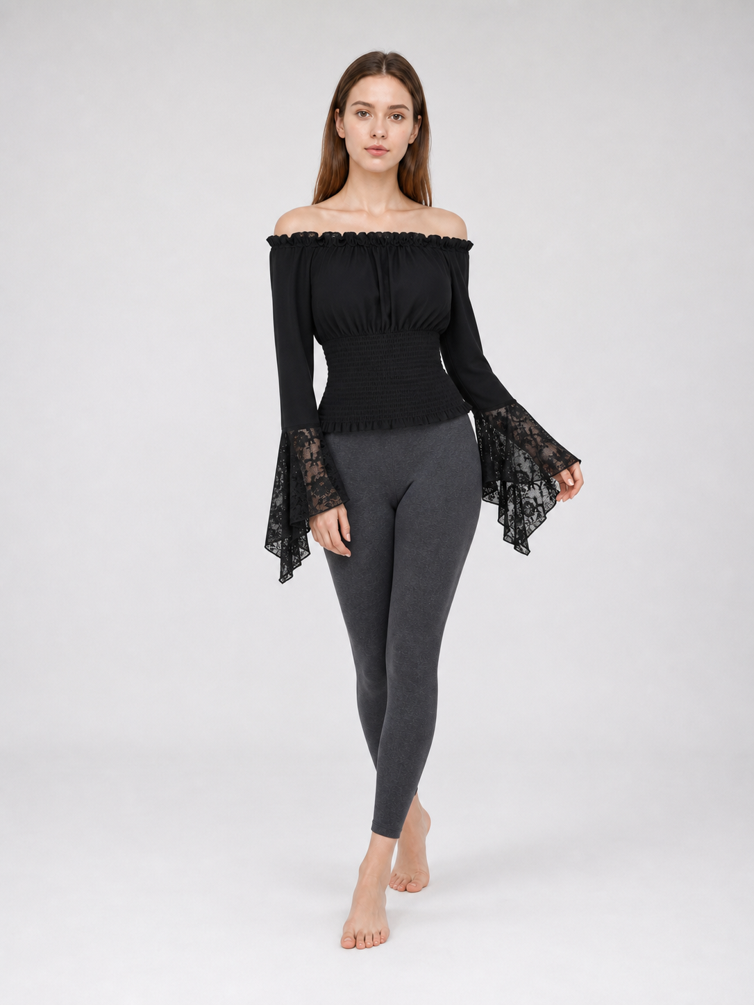 Black off-the-shoulder blouse with ruffles and long sleeves