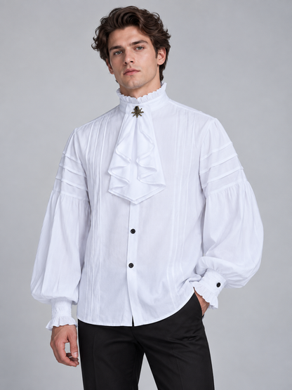 White shirt with a high collar, ruffles, and a brooch