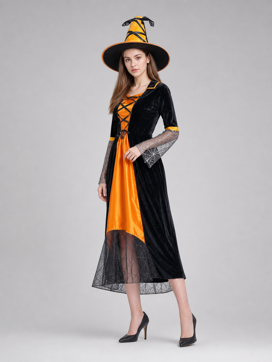 This Halloween costume includes a long dress and a pointed hat. The dress is in a black-and-orange color scheme: the center features a bright orange panel, and the black outer layer has a flared hem. The semi-sheer sleeves are decorated wit