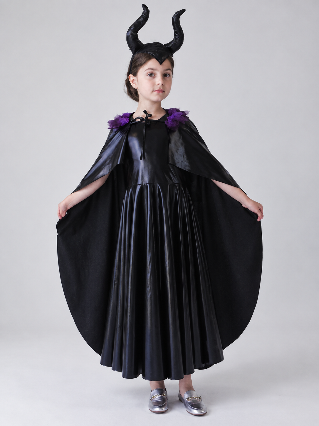 Costume: black dress, cape, headband with horns